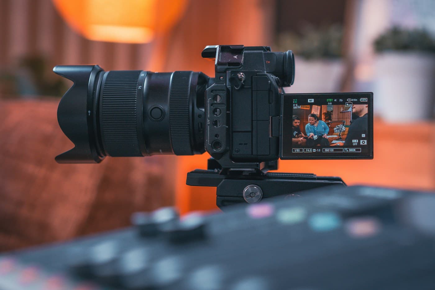 A professional camera recording an interview